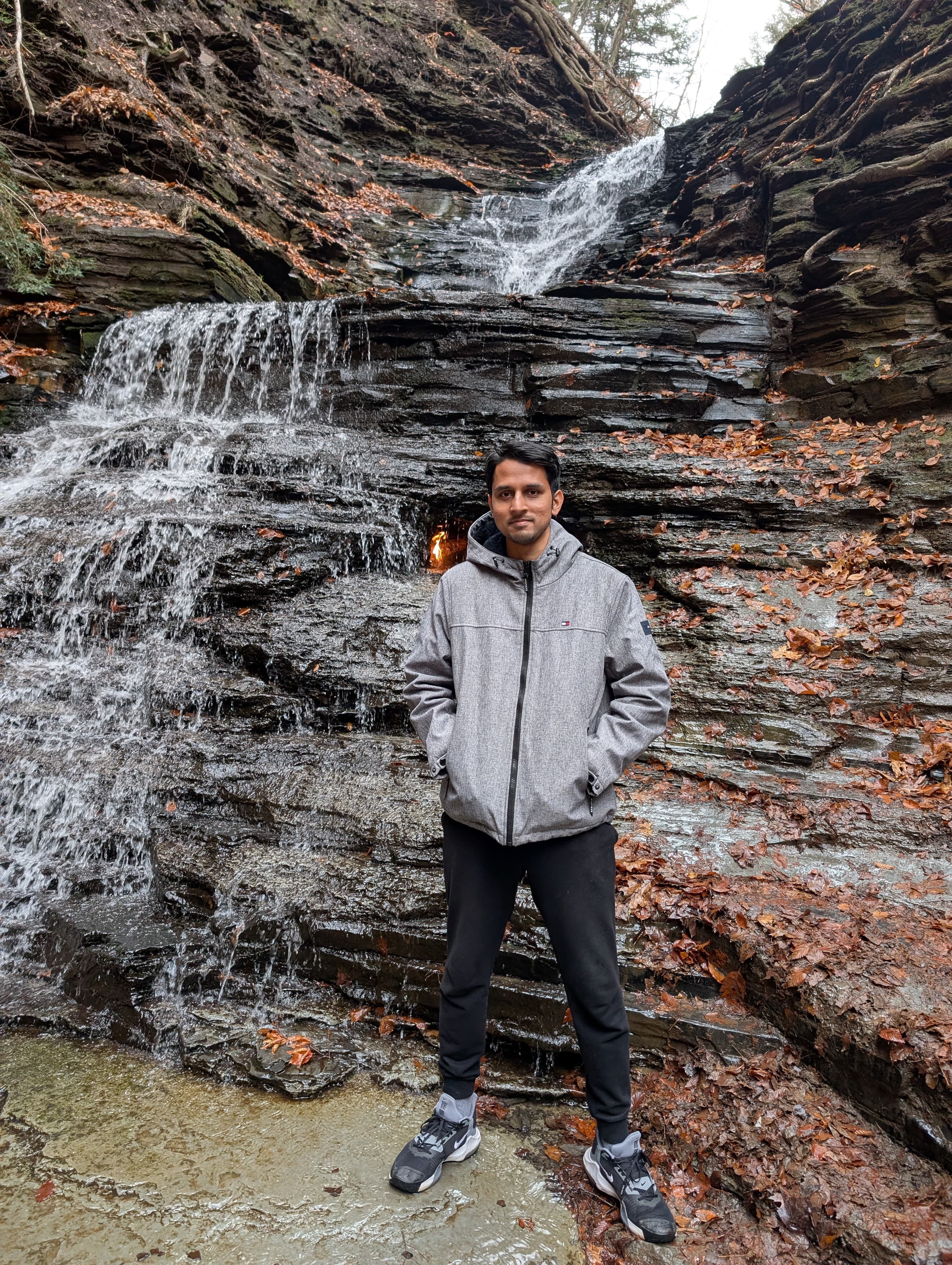 Adnan at Eternal Flame Falls, a natural gas flame burning in a grotto behind the falling water